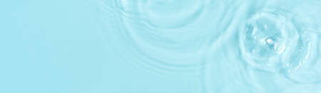 Blue water surface color background with ripples, circles and drops