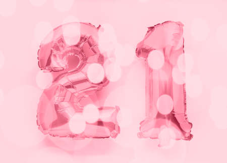 22 golden foil balloon numbers party decor on white background, birthday anniversary conceptの写真素材