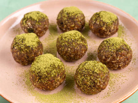 Matcha tea energy balls with nut butter and dried fruitの写真素材