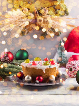Italian christmas cake with sweet decor and xmas ornament, lightsの写真素材