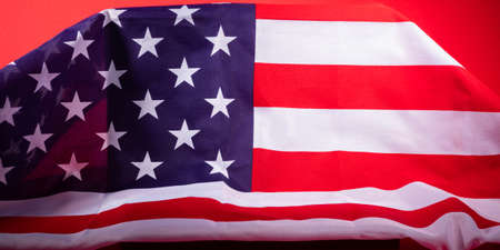 American stars and stripes flag on podium on red background