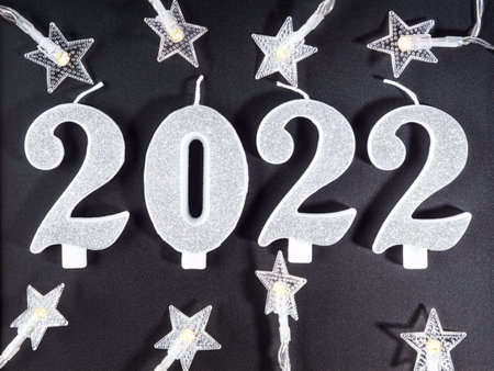 New year 2022 numbers on blackboard with star shape lightsの写真素材