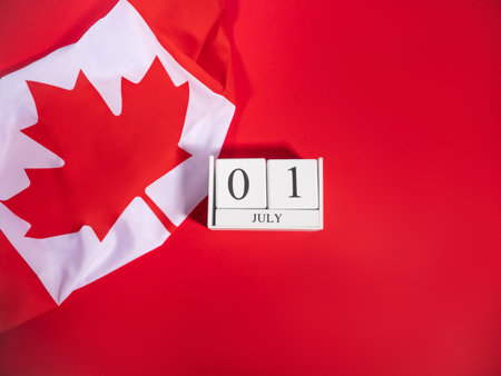 Canada Day, July 1 concept with Canadian flag on redの写真素材