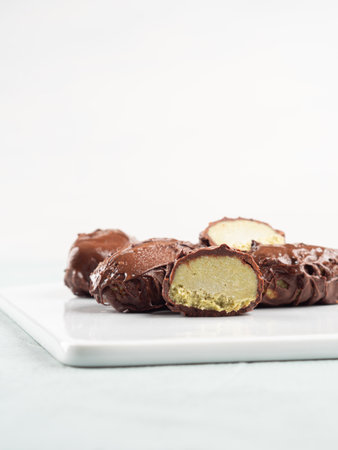 Chocolate coconut praline icecream bars with pistachio butterの写真素材