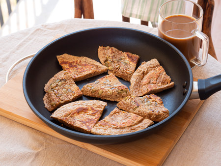 Closeup of homemade protein keto bread in skillet outdoorsの写真素材