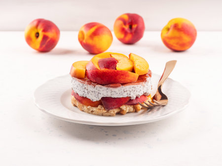Overnight chia pudding dessert with greek yogurt, peaches and jamの写真素材
