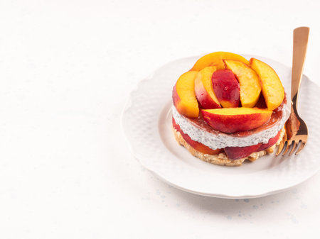 Overnight chia pudding dessert with greek yogurt, peaches and jamの写真素材
