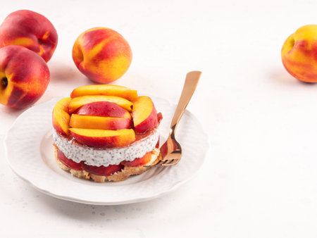 Overnight chia pudding dessert with greek yogurt, peaches and jamの写真素材