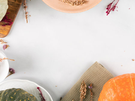 Autumn thanksgiving table setting pumpkin decor concept flatlay on grayの写真素材