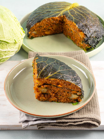 Chou farci, stuffed savoy cabbage pie with lentil quinoa raguの写真素材