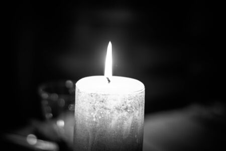 Candle in the darkの写真素材