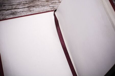 book and pen on wood backgroundの写真素材