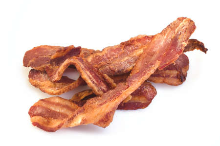 Crispy bacon rashers isolated against a white backgroundの写真素材