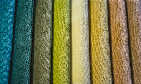 Close-up of different colored swatch fabric samples in a vertical patternの写真素材