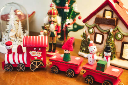 A Christmas themed wooden red toy train with elves and snowmenの写真素材