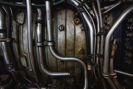 Inner workings of a jet engine with metal pipes and tubesの写真素材