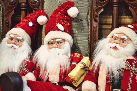 Santa Clause dolls on display in a Christmas toy shopの写真素材
