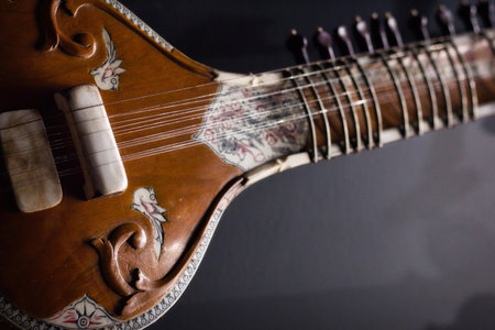 Closeup of an antique traditional Indian Sitar, or Vada, musical instrument with a gourd body and...