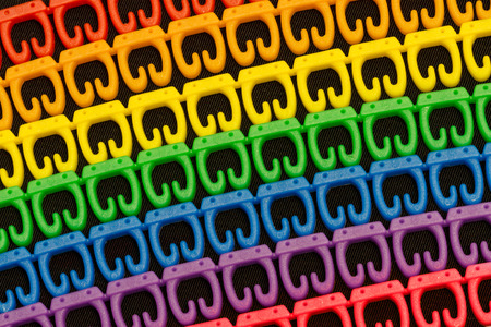 plastic tag for cable colors of the rainbow on a black background