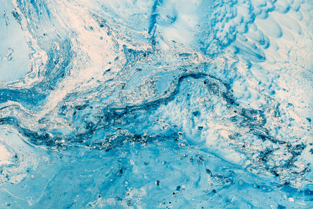 Blue marbling texture. Creative background with abstract oil painted waves, handmade surface. Liquid...