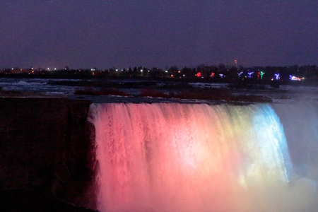 Image of the coloured lights at the Niagara Falls at nightの写真素材