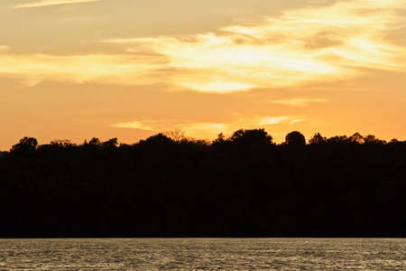 Background with an amazing sunset on a lakeの写真素材