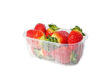 Strawberries in plastic box on white background  の写真素材