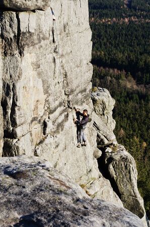 the climber climbs to the top szczelinicaの写真素材