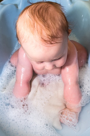 small caucasian nice baby in the barhの写真素材