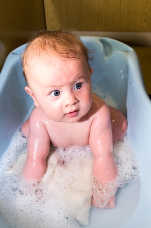 small caucasian nice baby in the barhの写真素材