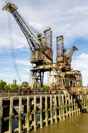 Old crane port on the River Thames in London, Englandの写真素材
