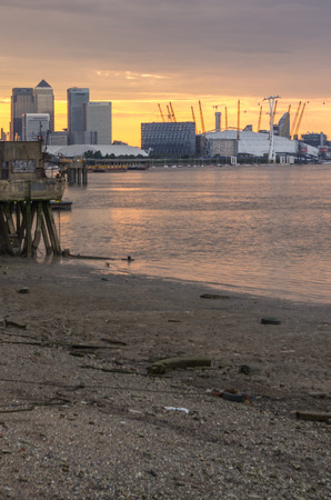 LONDON, UK - 26th JULY 2014: ,Thames river ,o2 arena and poor riverbank London on 26 July 2014のeditorial素材