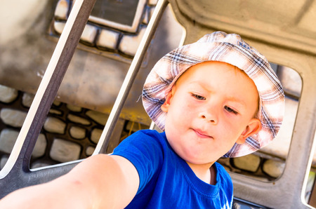 little boy, toddler on a carouselの写真素材