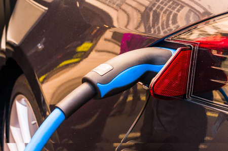 electric car connected to the chargerの写真素材