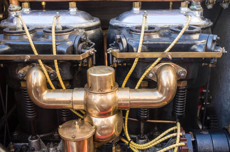 Old gasoline engine under the hood of oldtimer