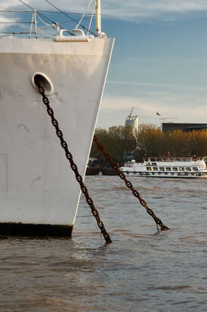 moored ship at thames river in Londonの写真素材