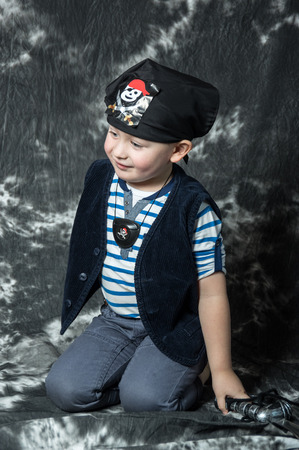 Young caucasian boy posing as piratの写真素材