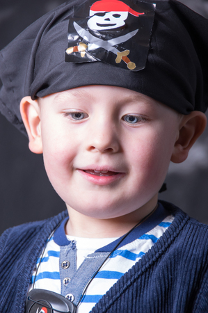 Young caucasian boy posing as piratの写真素材
