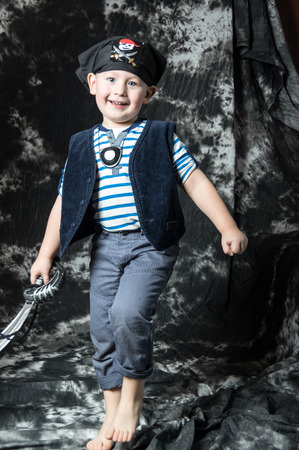 Young caucasian boy posing as piratの写真素材