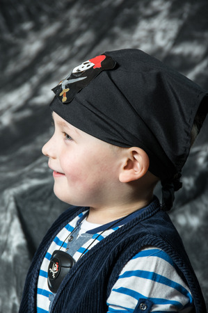 Young caucasian boy posing as piratの写真素材