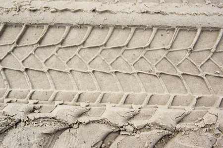 tire pattern imprinted on the sandの写真素材