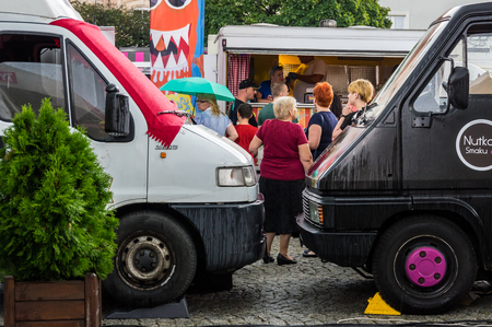 TARNOWSKIE GORY. POLAND  - july 30: A people buy meals from food trucks July 30, 2016 in Tarnowskie gory, Silesia, Polandのeditorial素材