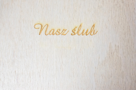 engraved text 'nasze wesele' at woode surfaceの写真素材