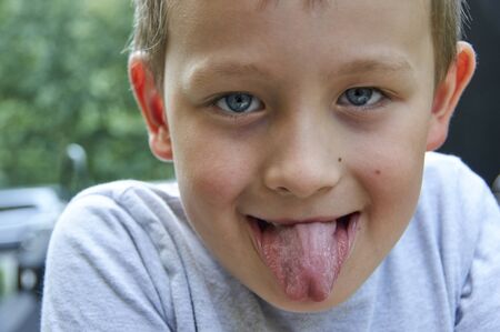 boy to stick out one's tongueの写真素材