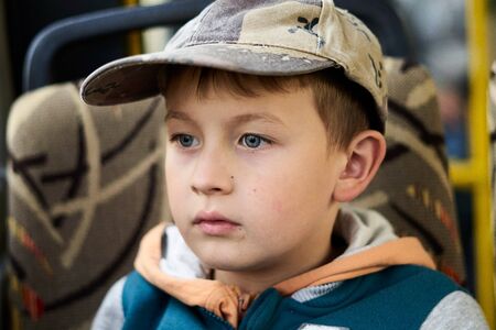 a aucasian sad boy, looking away