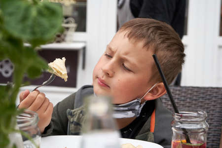 A white nice boy look watchin at dumplingの写真素材