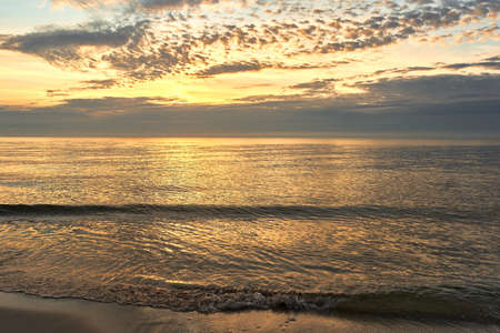 A sunrise on  Baltic sea, Poland, Hel beachの写真素材