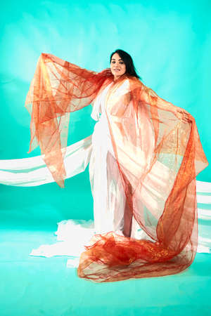 Cute brunette, white gitl weared white tulle and dancingの写真素材