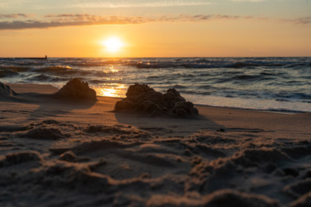 Sunset on Baltic sea beachの写真素材