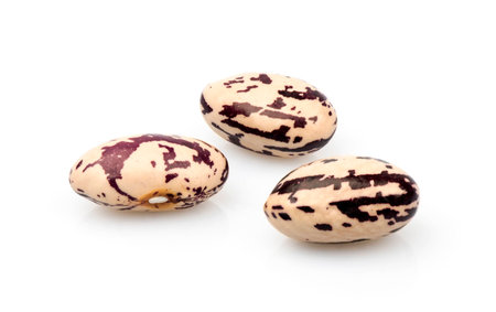 three colored beans on white background